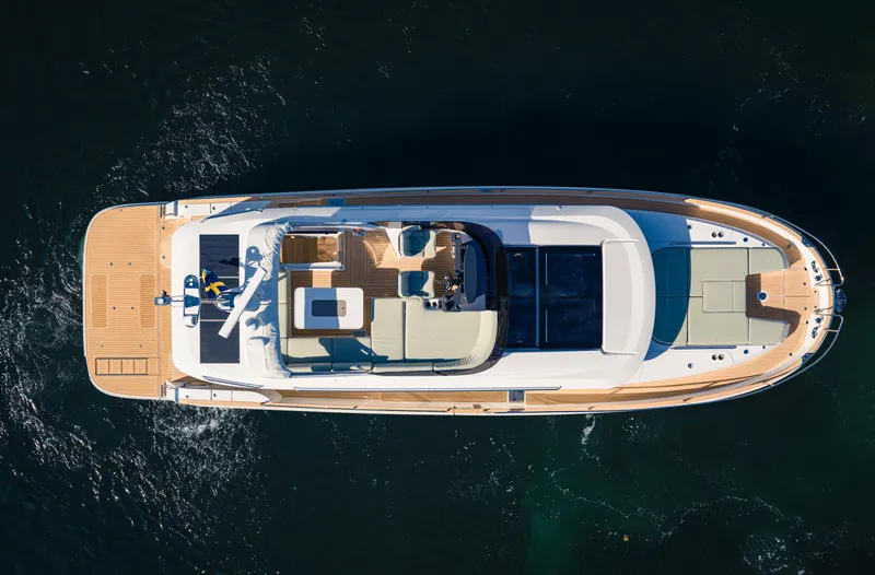 Slide: The Image of Aerial view of 2025 Nimbus 495 Flybridge yacht on water. - 34