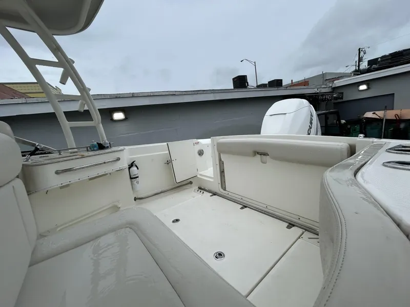 Slide: The Image of 2018 Boston Whaler 230 Vantage boat interior, featuring spacious seating and modern design. - 9