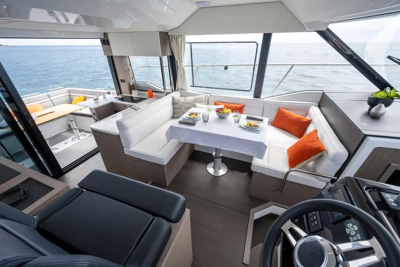 Slide: The Image of Luxurious interior of 2026 Jeanneau NC1295 Fly yacht with ocean view. - 4
