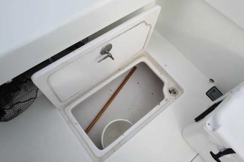 Slide: The Image of Open storage compartment on 2022 Valentino 28CC boat deck. - 18
