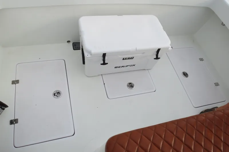 Slide: The Image of Valentino 28CC 2022 boat deck with storage hatches and cooler. - 19