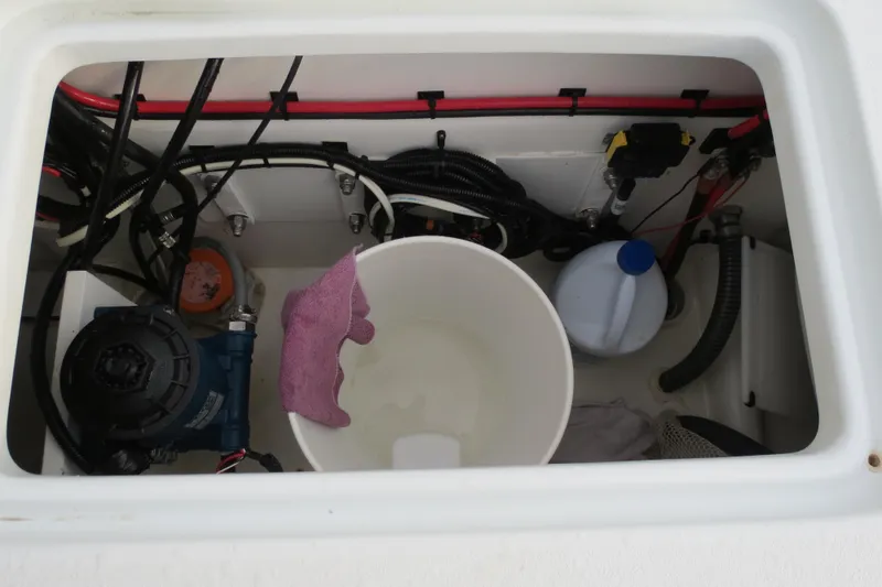 Slide: The Image of Valentino 28CC 2022 boat compartment with equipment, bucket, and cleaning supplies. - 22