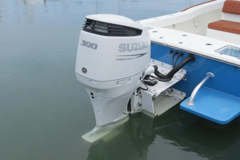 Slide: The Image of Valentino 28CC 2022 boat with Suzuki 300 outboard motor on calm water. - 25