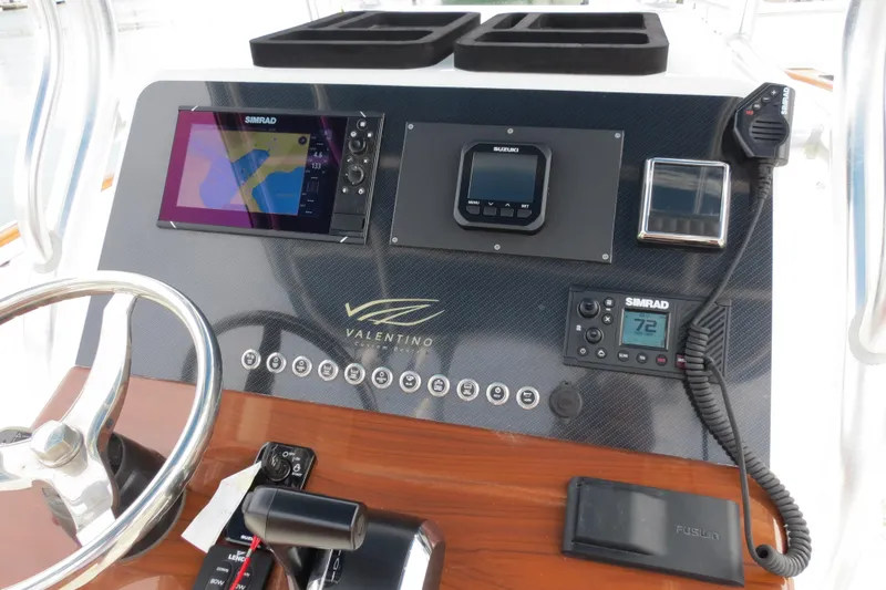 Slide: The Image of Control panel of 2022 Valentino 28CC boat with navigation and communication equipment. - 27