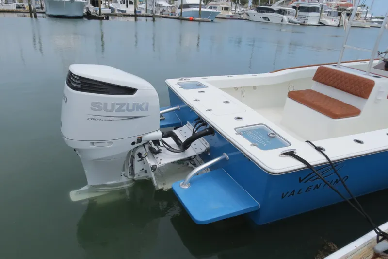 Slide: The Image of Valentino 28CC boat with Suzuki outboard motor docked in marina, 2022 model. - 32