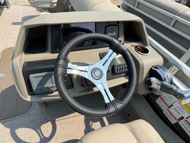 Slide: The Image of Steering console of 2025 Sun Tracker Fishin' Barge 22 XP3 pontoon boat. - 13