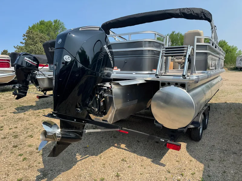 Slide: The Image of 2025 Sun Tracker Fishin' Barge 22 XP3 pontoon boat with powerful outboard motor. - 4