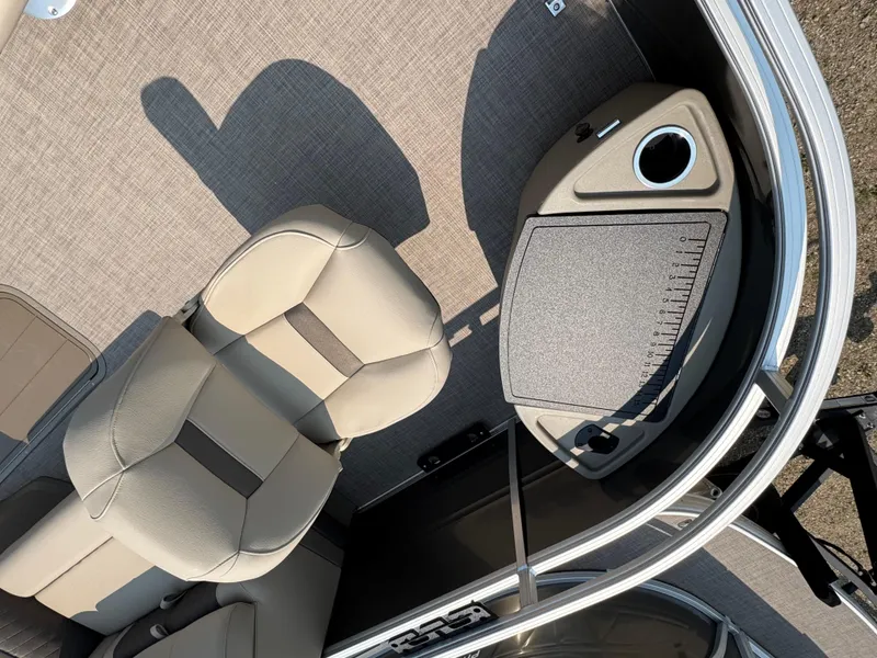 Slide: The Image of 2025 Sun Tracker Fishin' Barge 22 XP3 interior with seating and console detail. - 6