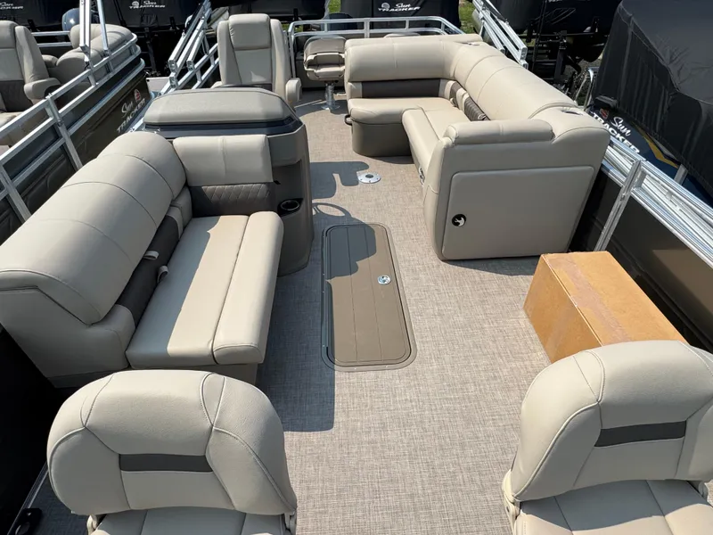 Slide: The Image of 2025 Sun Tracker Fishin' Barge 22 XP3 interior with beige seating and spacious layout. - 9