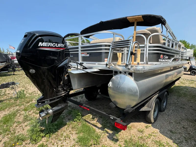 Slide: The Image of 2023 Sun Tracker Fishin' Barge 20 DLX pontoon boat with Mercury engine on trailer. - 3