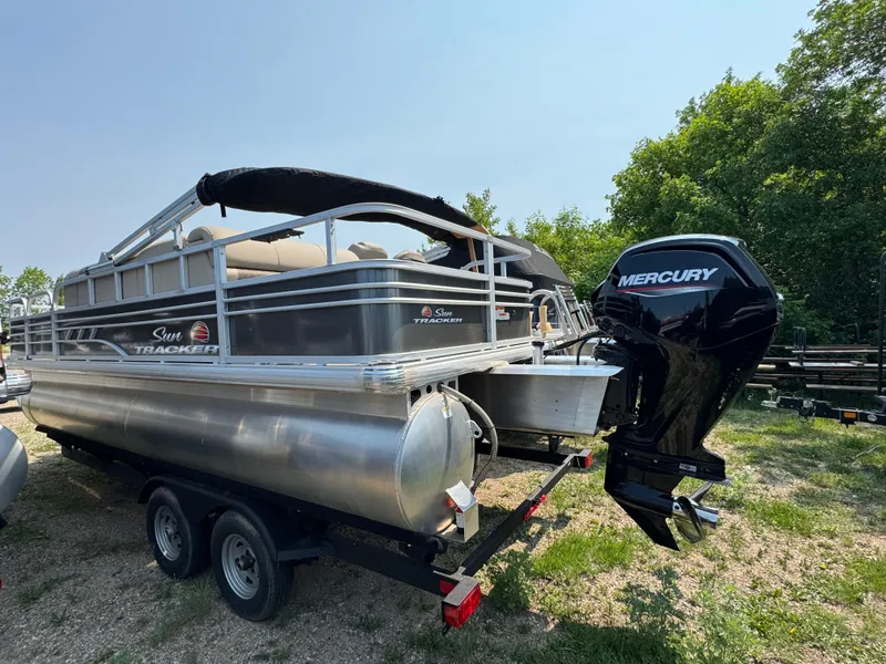 Slide: The Image of 2023 Sun Tracker Fishin' Barge 20 DLX pontoon boat with Mercury outboard motor. - 4