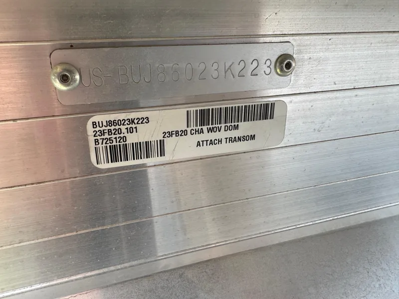 Slide: The Image of 2023 Sun Tracker Fishin' Barge 20 DLX identification plate with serial numbers and barcode. - 5