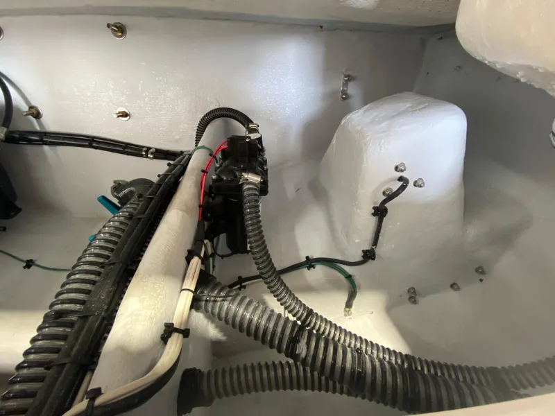 Slide: The Image of Interior view of 2026 Reef Runner 230 boat showing wiring and components. - 11