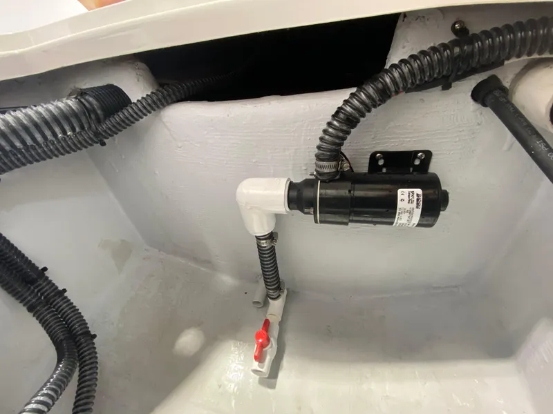 Slide: The Image of Bilge area of 2026 Reef Runner 230 boat with pump and wiring. - 15