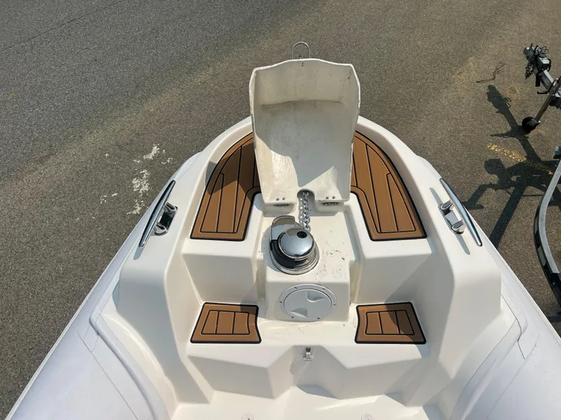 Slide: The Image of Nuova Jolly Prince 30 boat deck, 2017 model, featuring teak accents and anchor setup. - 16