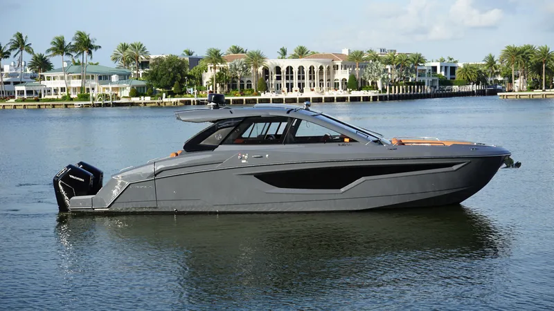 The Image of 2023 Cruisers Yachts 42 GLS OB on serene water, luxury boat with sleek design. - 0