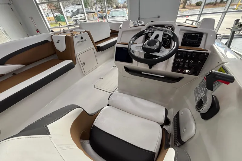 Slide: The Image of Interior of 2025 Starcraft SVX 191 OB with steering console. - 13