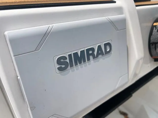 Slide: The Image of Interior of 2025 Starcraft SVX 191 OB with brown and white seating. - 3