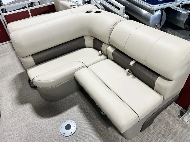 Slide: The Image of 2025 Sun Tracker PARTY BARGE® 22 RF DLX beige and brown seating with cup holders. - 10