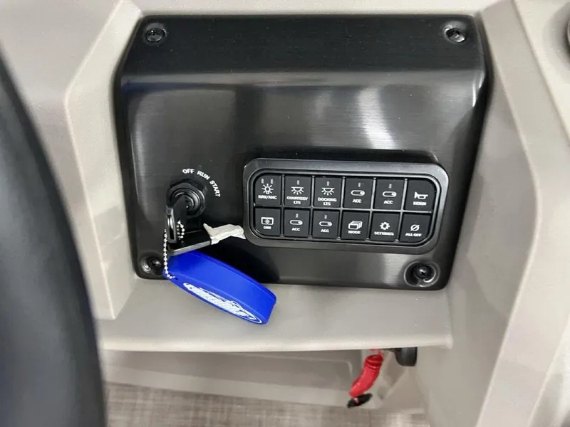 Slide: The Image of Control panel of 2025 Sun Tracker PARTY BARGE® 22 RF DLX with ignition and switches. - 15