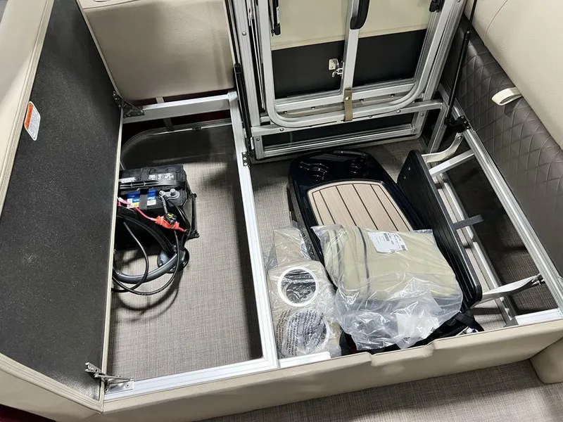 Slide: The Image of Interior storage compartment of 2025 Sun Tracker PARTY BARGE® 22 RF DLX pontoon boat. - 22