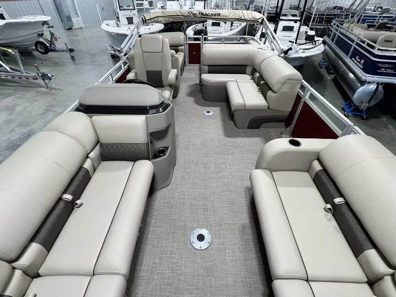 Slide: The Image of 2025 Sun Tracker PARTY BARGE® 22 RF DLX pontoon boat with spacious seating and modern design. - 24