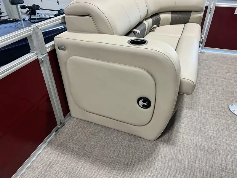Slide: The Image of 2025 Sun Tracker PARTY BARGE® 22 RF DLX interior with beige seating and cup holder. - 8
