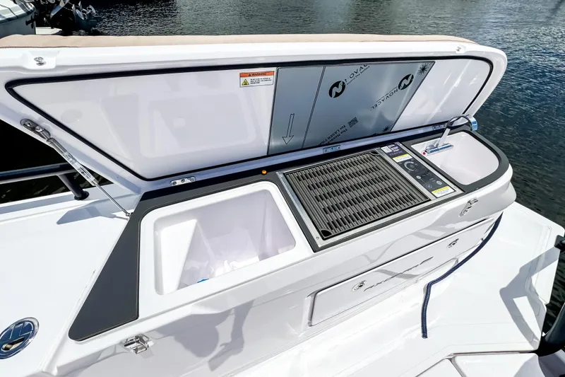 Slide: The Image of Axopar 45 Cross Top 2026 with integrated grill and storage. - 15