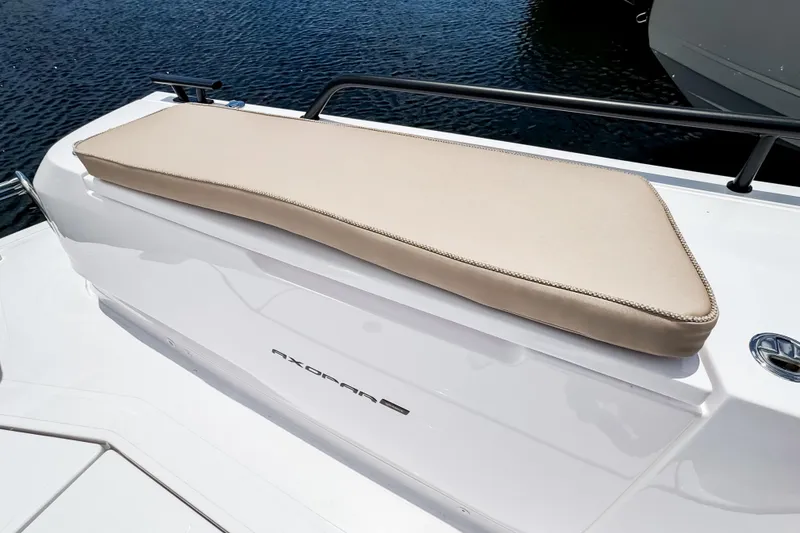 Slide: The Image of Axopar 45 Cross Top 2026 with beige seat cushion on white deck. - 18