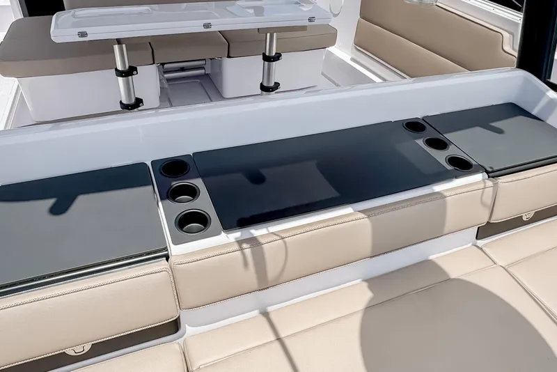 Slide: The Image of Interior of 2026 Axopar 45 Cross Top with seating and table. - 21