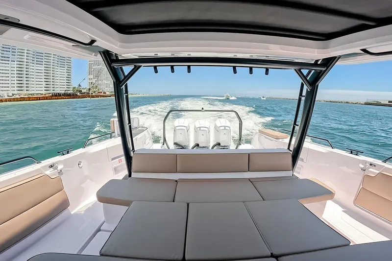 Slide: The Image of Luxurious 2026 Axopar 45 Cross Top boat interior with ocean view and modern seating. - 23