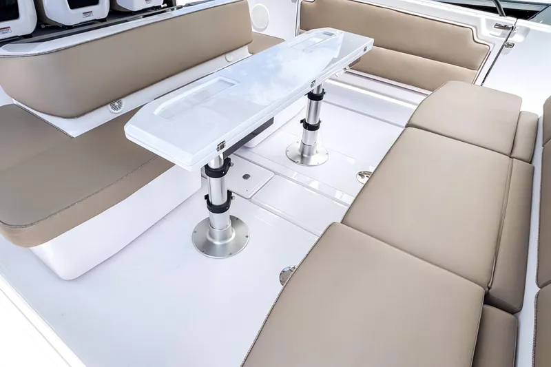 Slide: The Image of Interior of 2026 Axopar 45 Cross Top with beige seating. - 25
