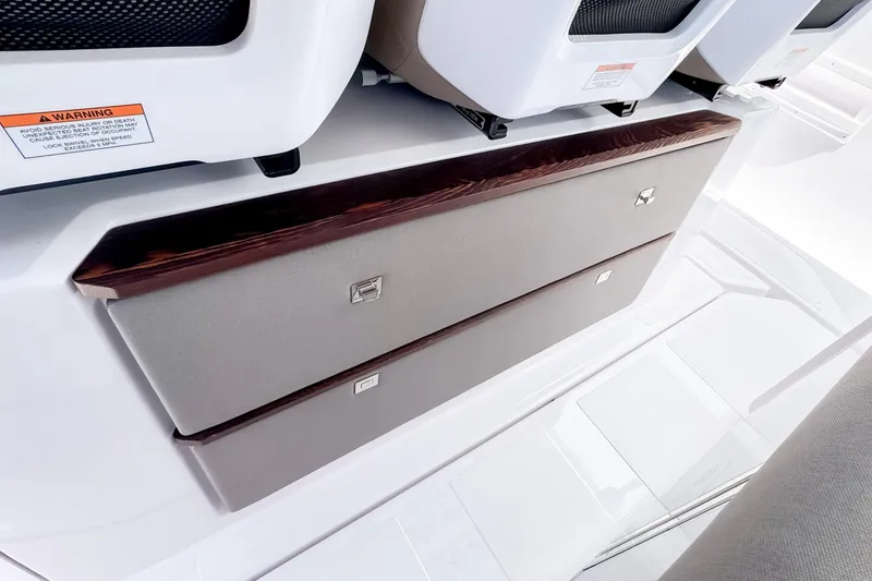 Slide: The Image of Interior of 2026 Axopar 45 Cross Top with storage compartment. - 31