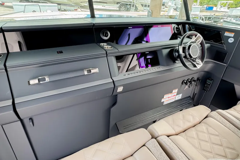 Slide: The Image of Interior of 2026 Axopar 45 Cross Top with modern dashboard. - 34