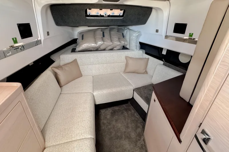 Slide: The Image of Interior of 2026 Axopar 45 Cross Top with cozy seating area. - 36