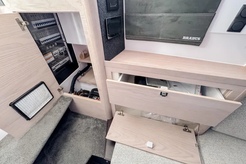 Slide: The Image of Interior of 2026 Axopar 45 Cross Top with storage and equipment. - 40