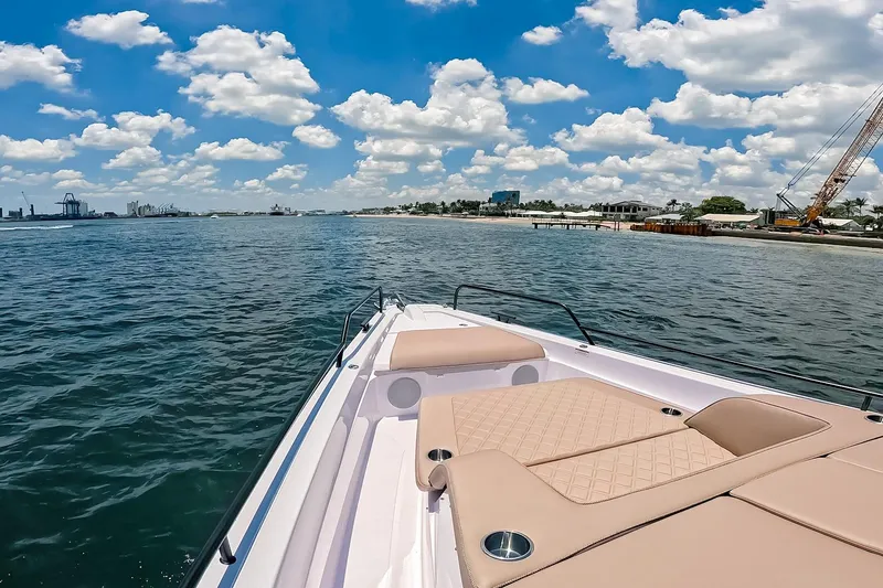 Slide: The Image of 2026 Axopar 45 Cross Top boat cruising on a sunny day with clear skies. - 44
