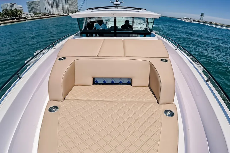 Slide: The Image of 2026 Axopar 45 Cross Top luxury boat with spacious sun deck on open water. - 45