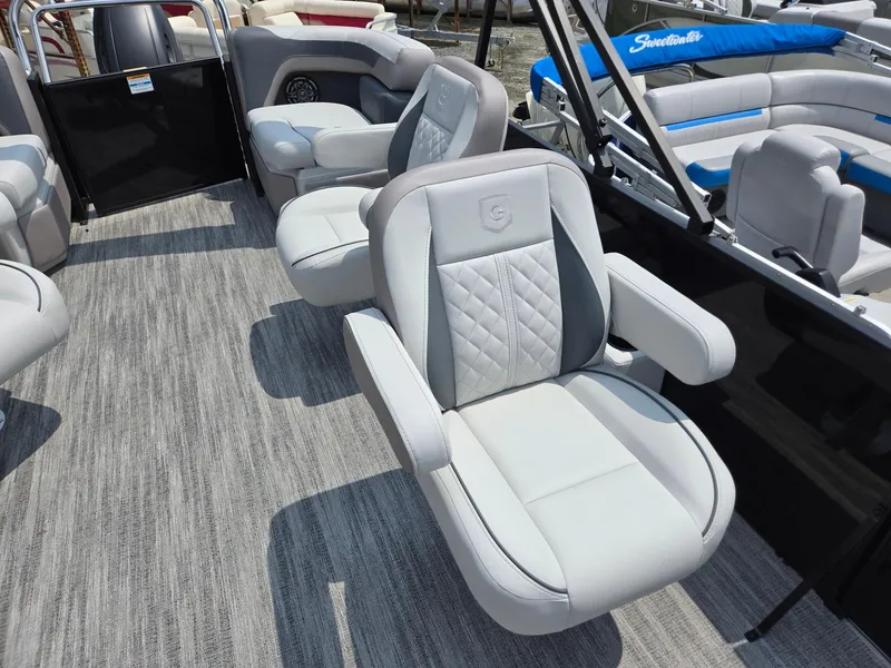 Slide: The Image of Luxurious seating on 2026 Godfrey Sweetwater 2286 QS pontoon boat, featuring plush gray upholstery. - 11