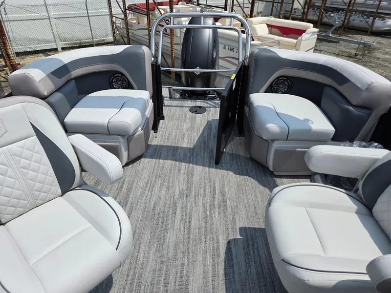 Slide: The Image of 2026 Godfrey Sweetwater 2286 QS pontoon boat interior with plush seating and modern design. - 19