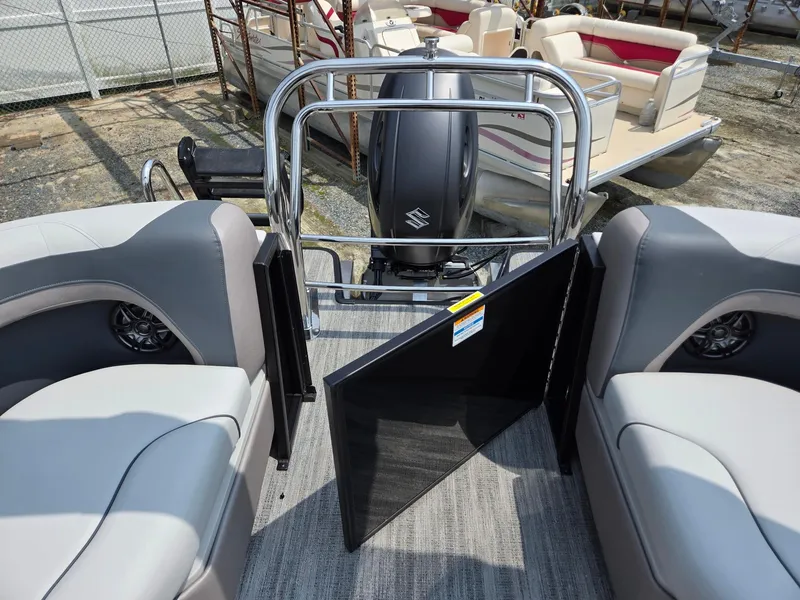 Slide: The Image of 2026 Godfrey Sweetwater 2286 QS pontoon boat interior with open gate and motor view. - 22