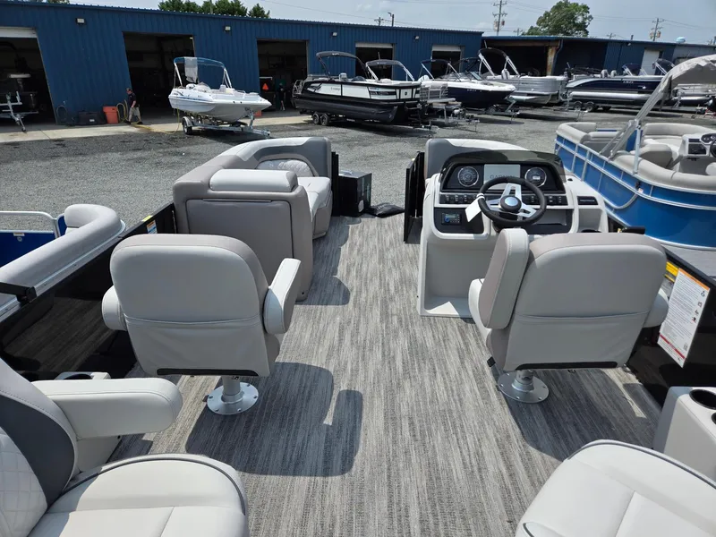 Slide: The Image of 2026 Godfrey Sweetwater 2286 QS pontoon boat interior with modern seating and control panel. - 28
