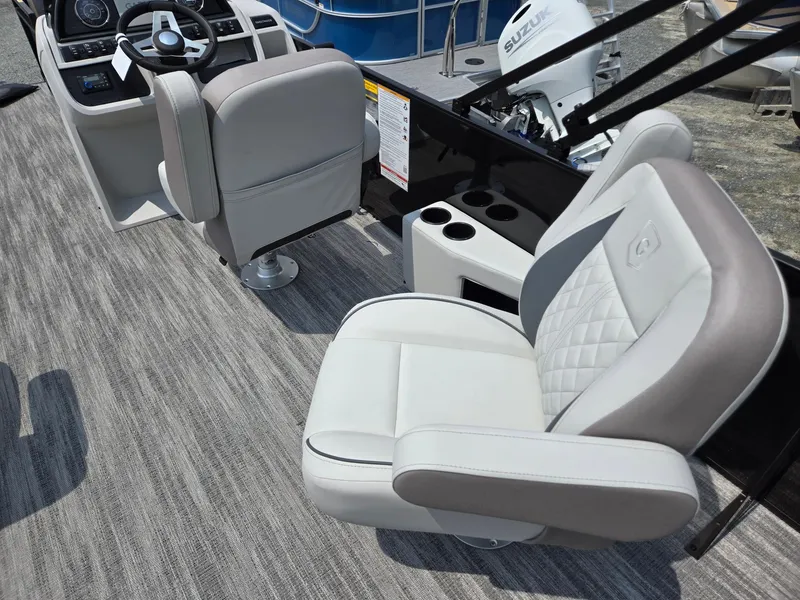 Slide: The Image of 2026 Godfrey Sweetwater 2286 QS boat interior with plush seating and modern helm. - 30