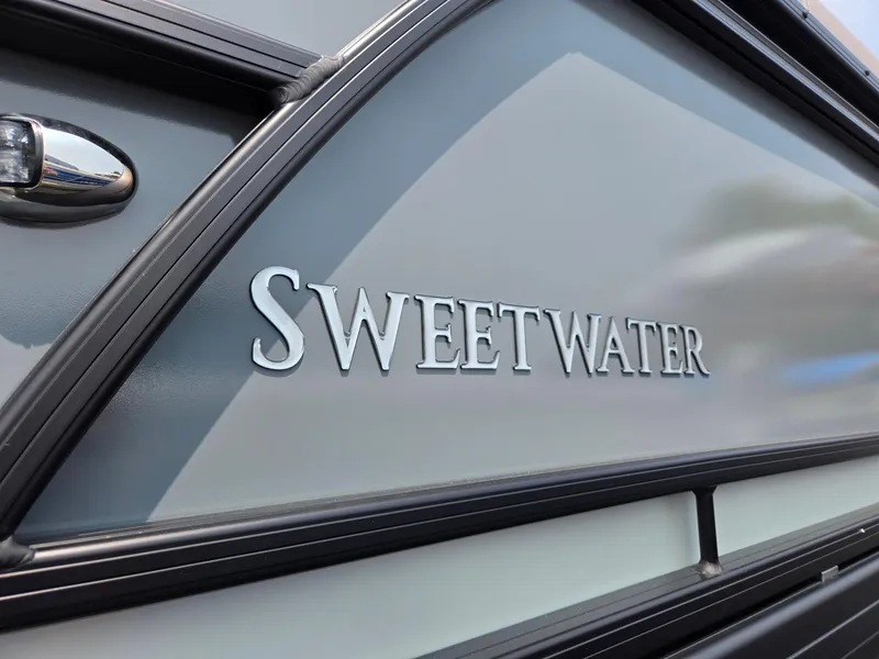 Slide: The Image of 2026 Godfrey Sweetwater 2286 QS boat exterior with logo detail. - 37