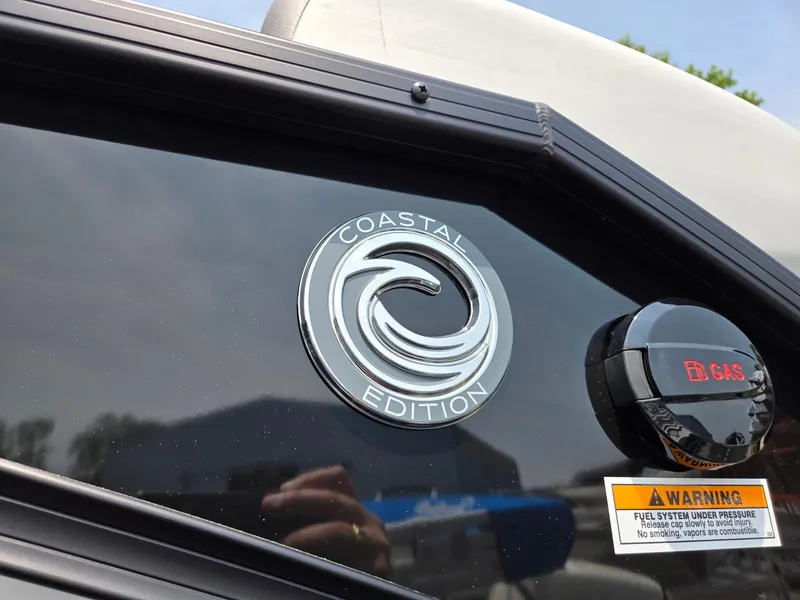 Slide: The Image of 2026 Godfrey Sweetwater 2286 QS Coastal Edition emblem on boat exterior. - 39