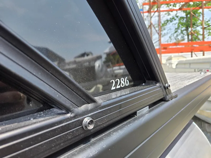 Slide: The Image of 2026 Godfrey Sweetwater 2286 QS boat window detail with visible model number. - 40