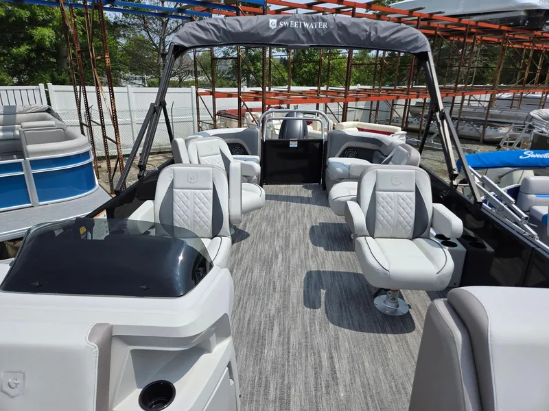Slide: The Image of 2026 Godfrey Sweetwater 2286 QS pontoon boat interior with plush seating and modern design. - 7
