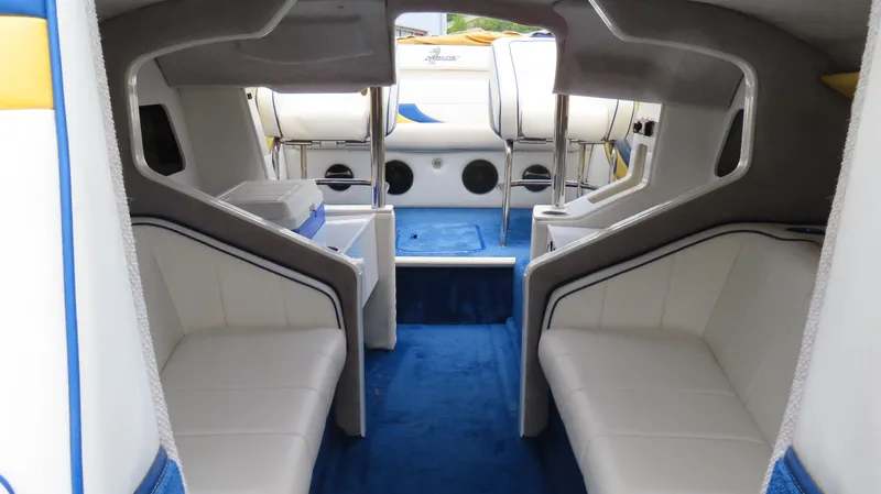 Slide: The Image of Interior of a 2002 Nordic 28 Heat boat with white and blue seating. - 10