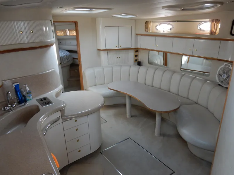 Slide: The Image of Luxurious interior of a 1997 Sea Ray 450 yacht with elegant seating and cabinetry. - 15