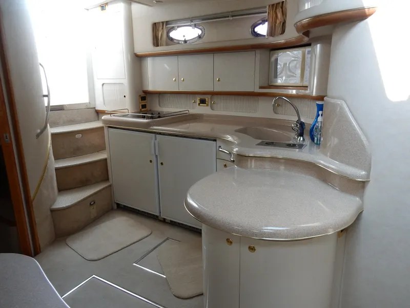 Slide: The Image of Luxurious 1997 Sea Ray 450 yacht interior with modern kitchen and elegant design. - 18